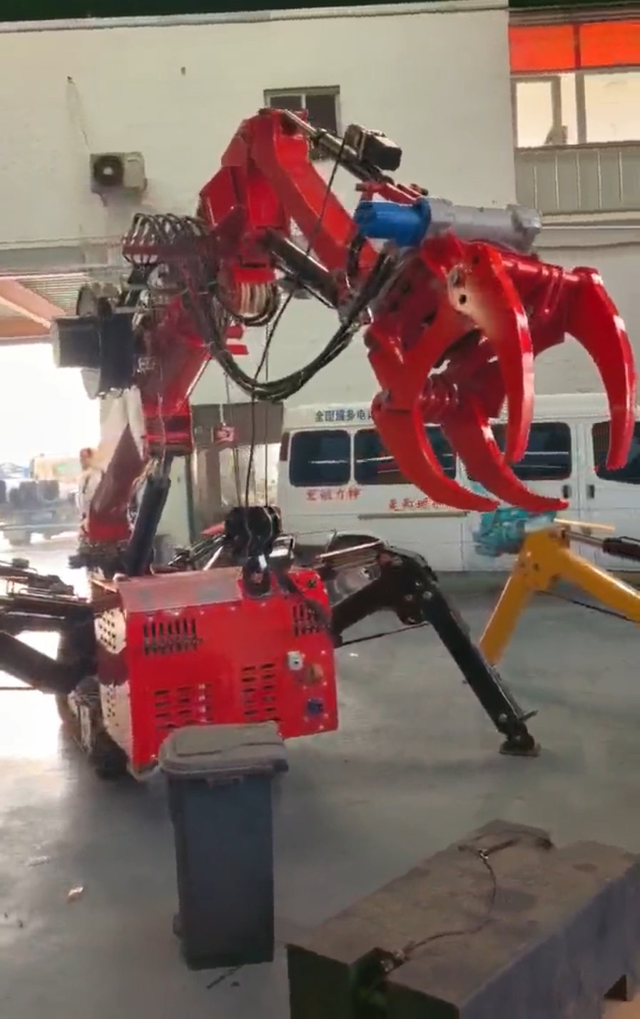 Risenmega spider crane fitted with a grab attachment for demolition debris and scrap handling