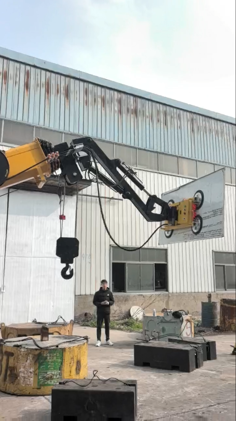 Risenmega spider crane fitted with vacuum suction cup attachment for lifting glass and panels